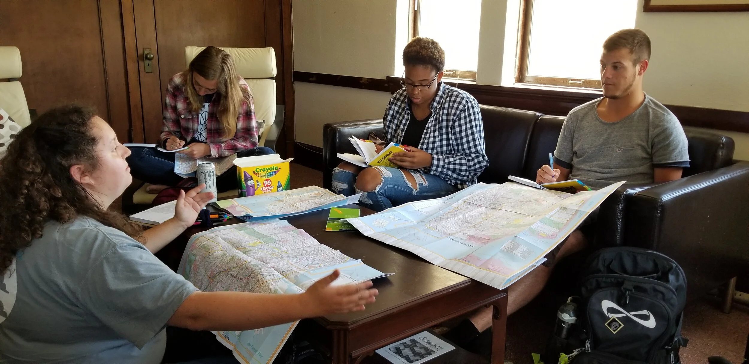 Students discussing and journaling together during Theology Together